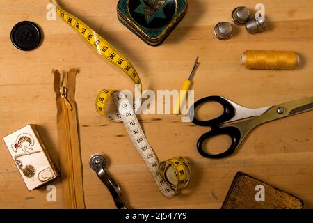 Sewing accessories on wooden board Stock Photo