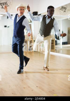 Two professional dancers practicing lindy hop in dance class Stock Photo