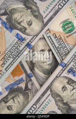 Vertical financial background made with one hundred dollars banknotes. Financial growth and business concept. Cash money background. Investments marke Stock Photo