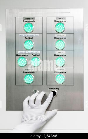 Scientist ,Lab technician checks safety levels on pressure chambers in biochemical lab.,Germany Stock Photo