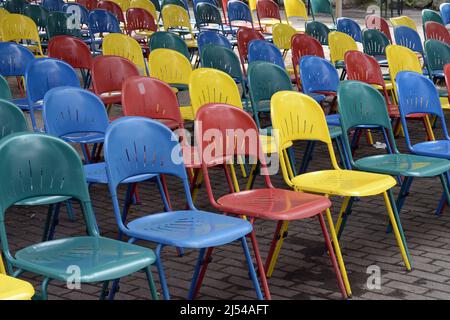 Spreepark, many colourful folding chaird in front of a stage at the former amusement park of the GDR, Germany, Berlin Stock Photo