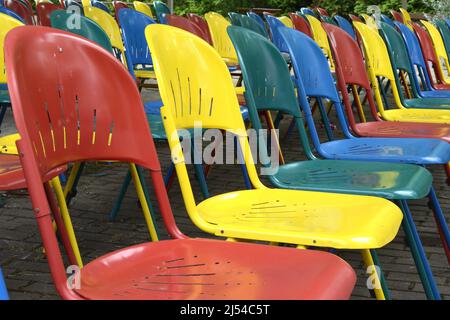 Spreepark, many colourful folding chaird in front of a stage at the former amusement park of the GDR, Germany, Berlin Stock Photo