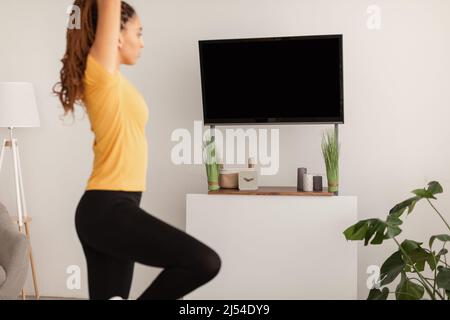 Cropped Shot Of Sporty Black Lady Doing Yoga At Home Stock Photo