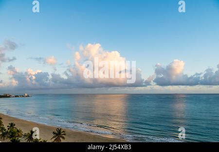 Early morning clouds over sla Verde  Beach on the Atlantic Ocean in the Metropolitan Area of San Juan in Carolina Puerto Rico, Stock Photo