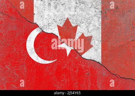 Turkey and canada flag on a cracked old concrete wall Stock Photo