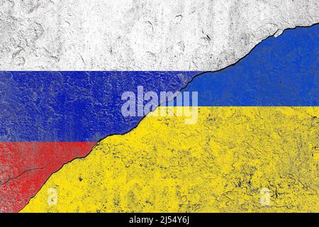 Ukraine and russia flag on a cracked old concrete wall Stock Photo