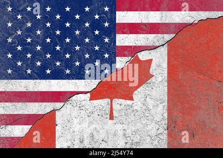 United states and canada flag on a cracked old concrete wall Stock Photo
