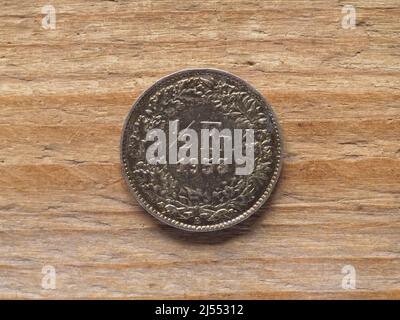 Half franc coin currency of Switzerland over wooden background Stock Photo