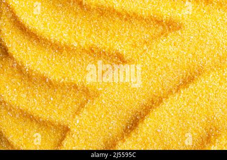 Abstract background of uncooked cornmeal. Stock Photo