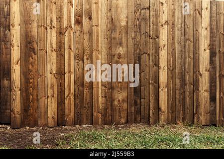 Backyard wooden fence as copy space and background, worn wood boards texture Stock Photo