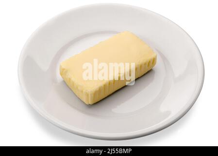 Piece of centrifuged butter in white dish isolated on white Stock Photo