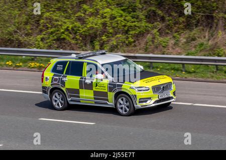 National Highways Traffic Officer driving 2021 Volvo Xc90 Momentum T8 Rchrg AWD A Hybrid Electric vehicle on the M61 motorway UK Stock Photo