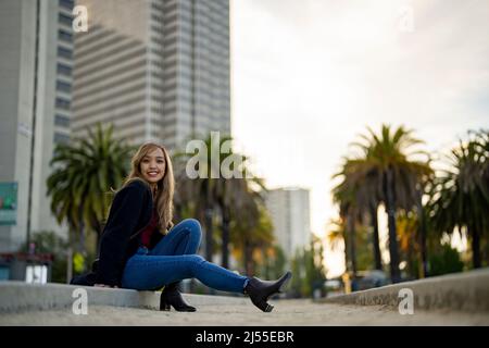 Young Woman in Casual Fall Wardrobe on Outdoor Bocce Ball Court in San Francisco | Lifestyle Local Tourism in the City Stock Photo