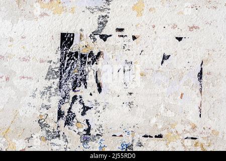 Dirty damaged texture, peeling plaster on painted brick wall with stains, ruined plaster, cracks. Vintage background