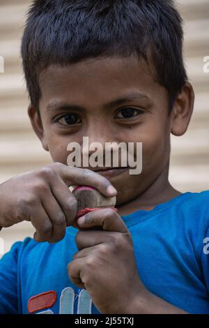 The action of a child in the hands of Latim. This is the traditional art of Bangladesh.Photo was taken March 21, 2022. Stock Photo