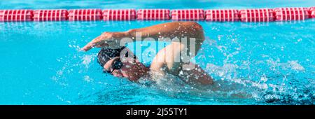 Swimming pool sport crawl swimmer athlete banner. Man doing freestyle stroke technique in water pool lane training for competition. Healthy active Stock Photo
