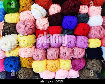 multicolored woolen threads in a ball for knitting close up, the concept of sewing, knitting and needlework Stock Photo