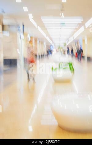 Walking people in shopping mall. Retail Store concept. Abstract blurred and Defocused Background