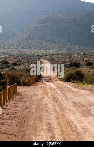 Dirt Road in Cabo de Gata, Nijar Natural Park, Almeria, Andalusia, Spain Stock Photo