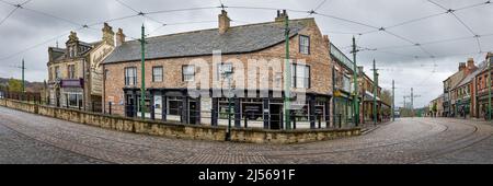 Panorama of shops and cobbled street at Beamish open air museum, County Durham, England. Stock Photo