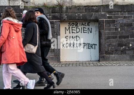 Graffiti, slogan, saying, on a wall on the Altstadtufer in Düsseldorf, Social media are corrupted, criticism, corruption, Stock Photo