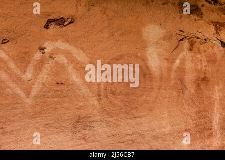 A pictograph rock art panel depicting anthropomorphic figures and geometric designs in Montezuma Canyon in Utah.  This Ancestral Puebloan Native Ameri Stock Photo