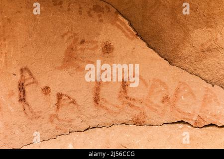 A pictograph rock art panel depicting images of Kokopelli, the flute player, in Montezuma Canyon in southeastern Utah.  This Ancestral Puebloan Native Stock Photo