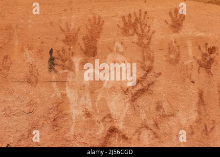 A pictograph rock art panel depicting anthropomorphic figures, handprints and animals in Montezuma Canyon in Utah.  This Ancestral Puebloan Native Ame Stock Photo