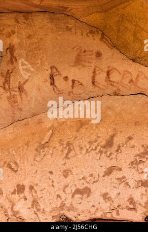 A pictograph rock art panel depicting images of Kokopelli, the flute player, in Montezuma Canyon in southeastern Utah.  This Ancestral Puebloan Native Stock Photo