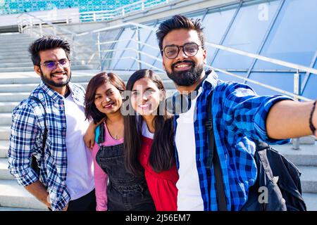 infian best friends spending time together outdoors in spring park Stock Photo