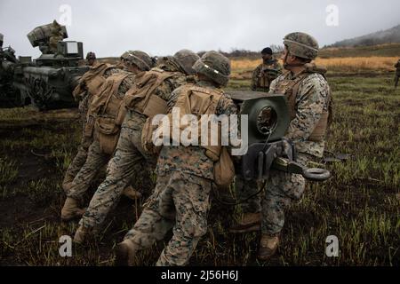 Kusu, Oita, Japan. 14th Apr, 2022. U.S. Marines assigned to 3d Battalion, 12th Marines, 3d Marine Division emplace an M777 towed 155 mm howitzer during Artillery Relocation Training Program 22.1 at the Japan Ground Self-Defense Force Hijudai Training Area, Japan, April 14, 2022. ARTP is an exercise which contributes to the defense of Japan and the U.S.-Japan Alliance as the cornerstone of peace and security in the Indo-Pacific region. The skills developed at ARTP increase the lethality and proficiency of the only permanently forward-deployed artillery unit in the Marine Corps, enabling them Stock Photo