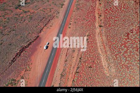 red country of west Australia, going north along the Western Australian highway. Vast country with spinifex growing