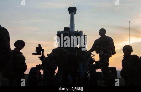 Kusu, Oita, Japan. 16th Apr, 2022. U.S. Marines with 3d Battalion, 12th Marines, 3d Marine Division, prepare to conduct fire missions with an M777 towed 155 mm howitzer during Artillery Relocation Training Program 22.1 at the Japan Ground Self-Defense Force Hijudai Training Area, Japan, April 16, 2022. ARTP is an exercise which contributes to the defense of Japan and the U.S.-Japan Alliance as the cornerstone of peace and security in the Indo-Pacific region. The skills developed at ARTP increase the lethality and proficiency of the only permanently forward-deployed artillery unit in the Mari Stock Photo