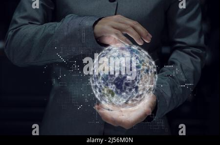 business woman holding hand around word graphic, world wild connection business concept, This element finnish by NASA Stock Photo