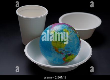 A globe in the paper eating utensils Stock Photo