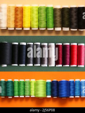 Many different threads on colorful background Stock Photo