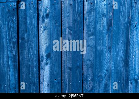 Wodden blue planks in various shades of colours, aged wodden wall of the cottage house surface making a good background material in royal blue color Stock Photo