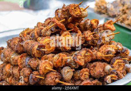 Toasted delicious street foods with stick close up shot on a dish Stock Photo