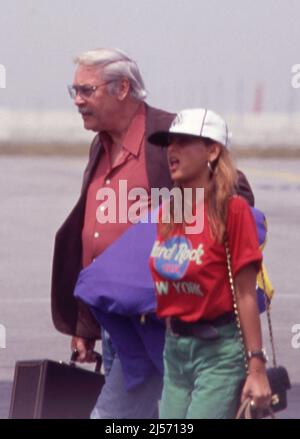 Jerry Buss and Jeanie Buss seen arriving at LAX Airport April 1992 Credit: Ralph Dominguez/MediaPunch Stock Photo