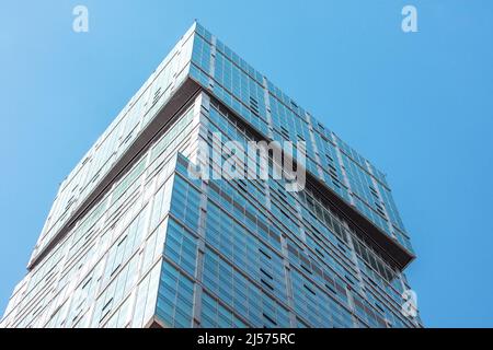 Glass facades of a window of financial skyscrapers, a corner of a building close-up Stock Photo