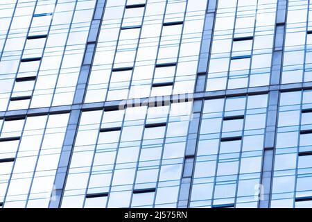 Abstract glass surface with geometric triangular shapes and dark inserts of other acute-angled shapes Stock Photo