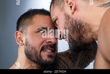 Angry man, upset guy. Screaming, hate, rage. Pensive man feeling furious mad and crazy stress, mirror. Negative human emotions facial expression Stock Photo