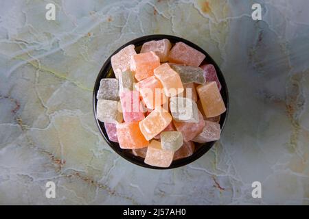 Traditional Turkish delight in a bowl on marble background Stock Photo