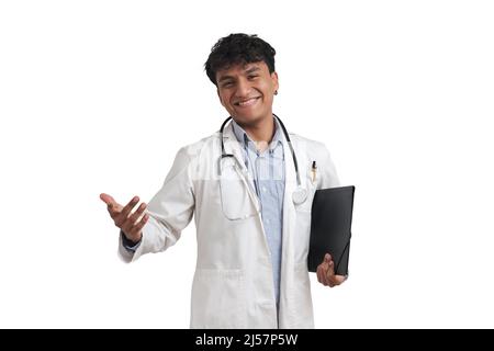 Young peruvian male doctor smiling and looking at camera, isolated. Stock Photo