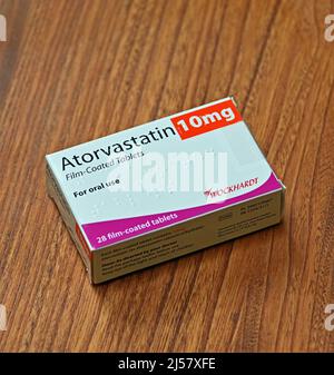 Photograph of Pack of Atorvastatin 10mg Film-Coated Tablets. For oral use. 28 film-coated tablets. Wockhardt Stock Photo