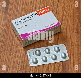 Photograph of Pack of Atorvastatin 10mg Film-Coated Tablets. For oral use. 28 film-coated tablets. Wockhardt Stock Photo