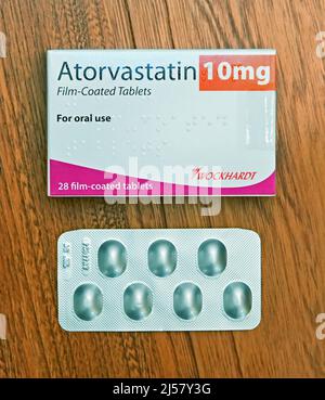 Photograph of Pack of Atorvastatin 10mg Film-Coated Tablets. For oral use. 28 film-coated tablets. Wockhardt Stock Photo