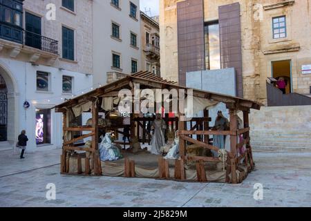Nativity scene in Valletta, Malta exhibiting figures representing the infant Jesus, his mother, Mary, and her husband, Joseph. Stock Photo