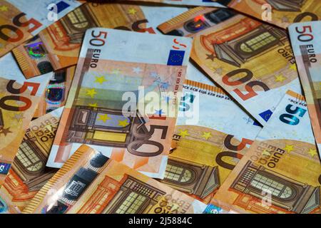 Lot of euro banknotes in denominations of fifty euros. Stock Photo
