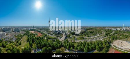 Panoramic view over Munich with the Olympic Tower in the Olympic Park under a blue sky in spring, Germany Stock Photo